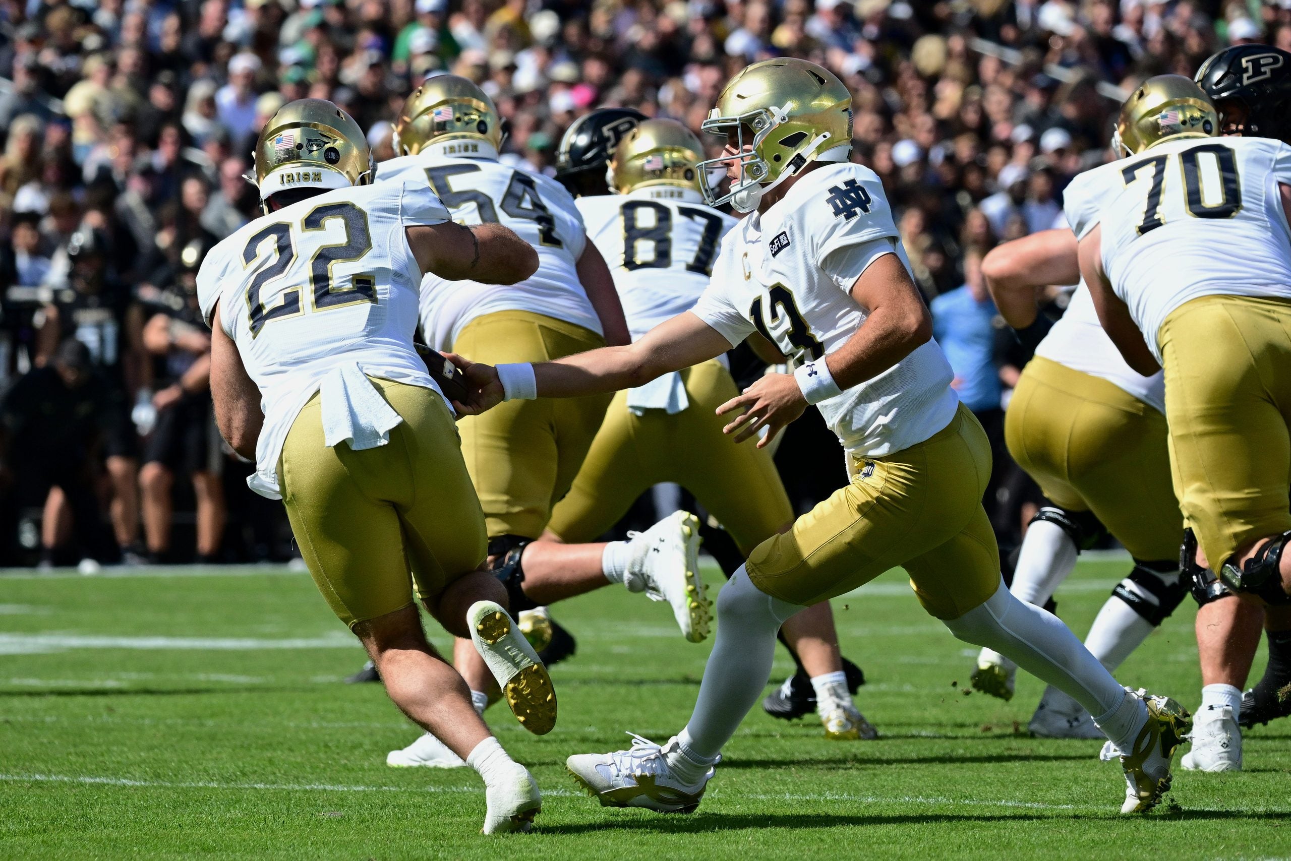 Sep 26, 2026; West Lafayette, Indiana, USA; Notre Dame Fighting Irish quarterback CJ Carr (13) hands the ball off to running back Aneyas Williams (22) in the first quarter against the Purdue Boilermakers at Ross-Ade Stadium.