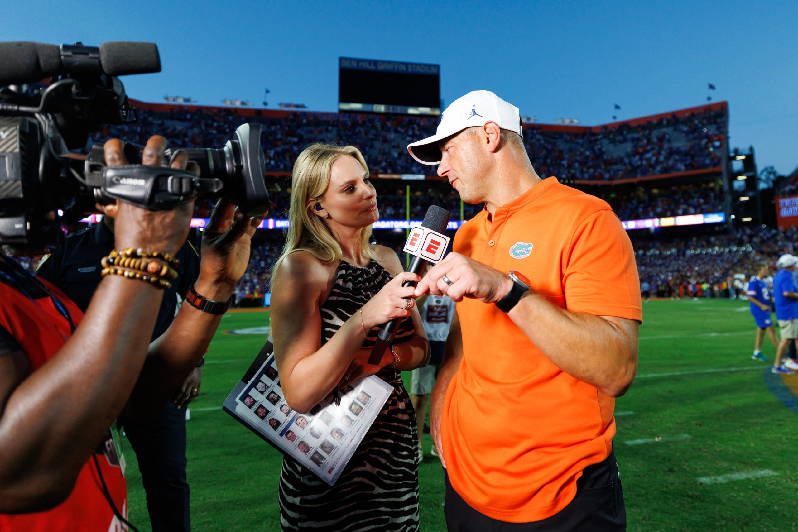 Sep 26, 2026; Gainesville, Florida, USA; ESPN sideline reporter Katie George talks with Florida Gators head coach Jon Sumrall after a game against the Mississippi Rebels at Ben Hill Griffin Stadium.