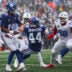 Sep 27, 2026; East Rutherford, New Jersey, USA; New York Giants running back Cam Skattebo (44) stumbles after colliding with quarterback Jameis Winston (19) during the first half against the Tennessee Titans at MetLife Stadium.