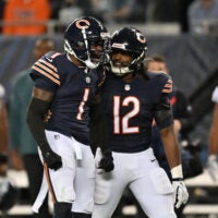 Sep 28, 2026; Chicago, Illinois, USA; Chicago Bears defensive back Jaylon Johnson (1) reacts with linebacker Devin Bush (12) during the second half against the Philadelphia Eagles at Soldier Field.