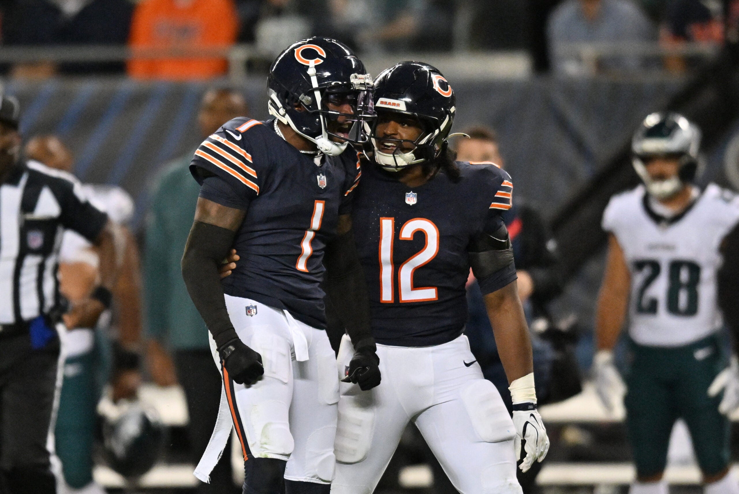 Sep 28, 2026; Chicago, Illinois, USA; Chicago Bears defensive back Jaylon Johnson (1) reacts with linebacker Devin Bush (12) during the second half against the Philadelphia Eagles at Soldier Field.