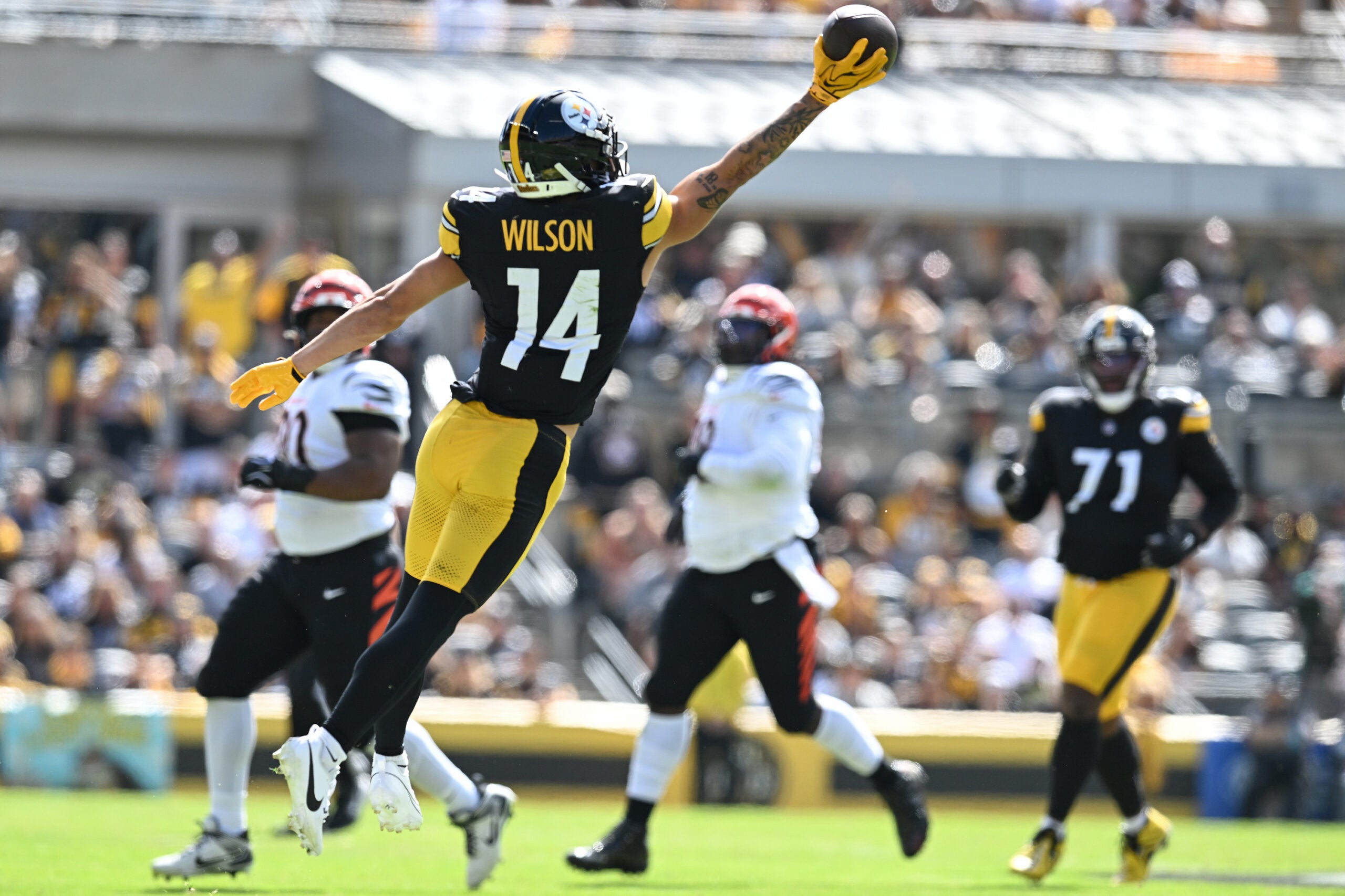Sep 27, 2026; Pittsburgh, Pennsylvania, USA; Pittsburgh Steelers wide receiver Roman Wilson (14) reaches for pass against the Cincinnati Bengals during the first half at Acrisure Stadium.