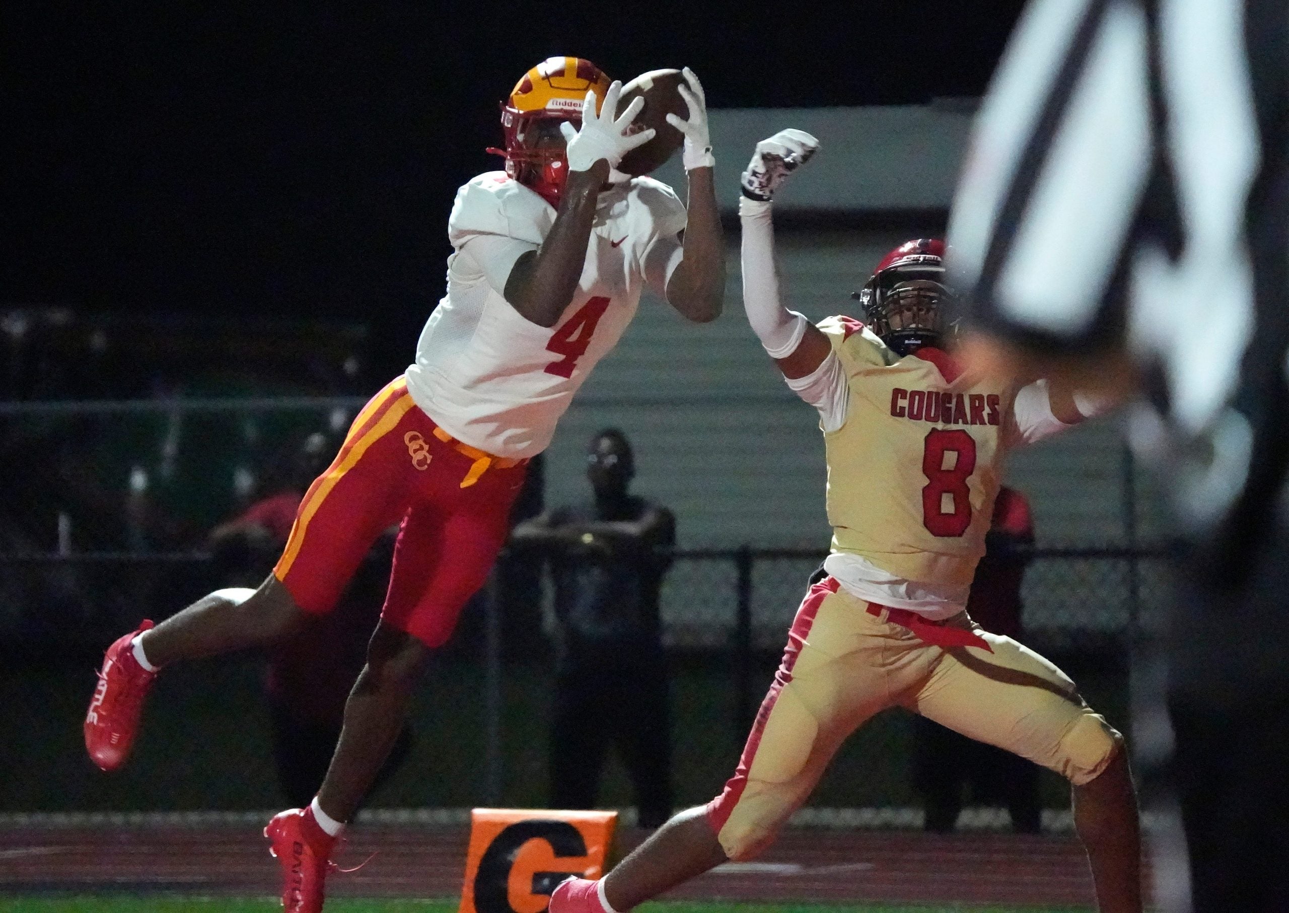 Clearwater Central Cathol wide receiver Daveon Belhomme (#4) makes a fingertip catch in the end zone ahead of Cardinal Mooney defender Jared Sanders (#8). Cardinal Mooney Catholic High School hosted Clearwater Central Catholic High School in varsity football Friday evening, Oct. 2, 2026.