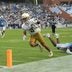 Oct 3, 2026; Chapel Hill, North Carolina, USA; Notre Dame Fighting Irish running back Nolan James Jr. (2) socres a touchdown as North Carolina Tar Heels defensive back Jaiden Patterson (18) defends in the second half at Kenan Stadium.