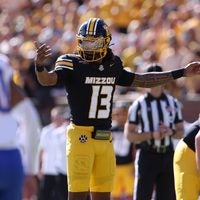 Oct 3, 2026; Columbia, Missouri, USA; Missouri Tigers quarterback Austin Simmons (13) calls a play in the first quarter against the Florida Gators at Faurot Field at Memorial Stadium.