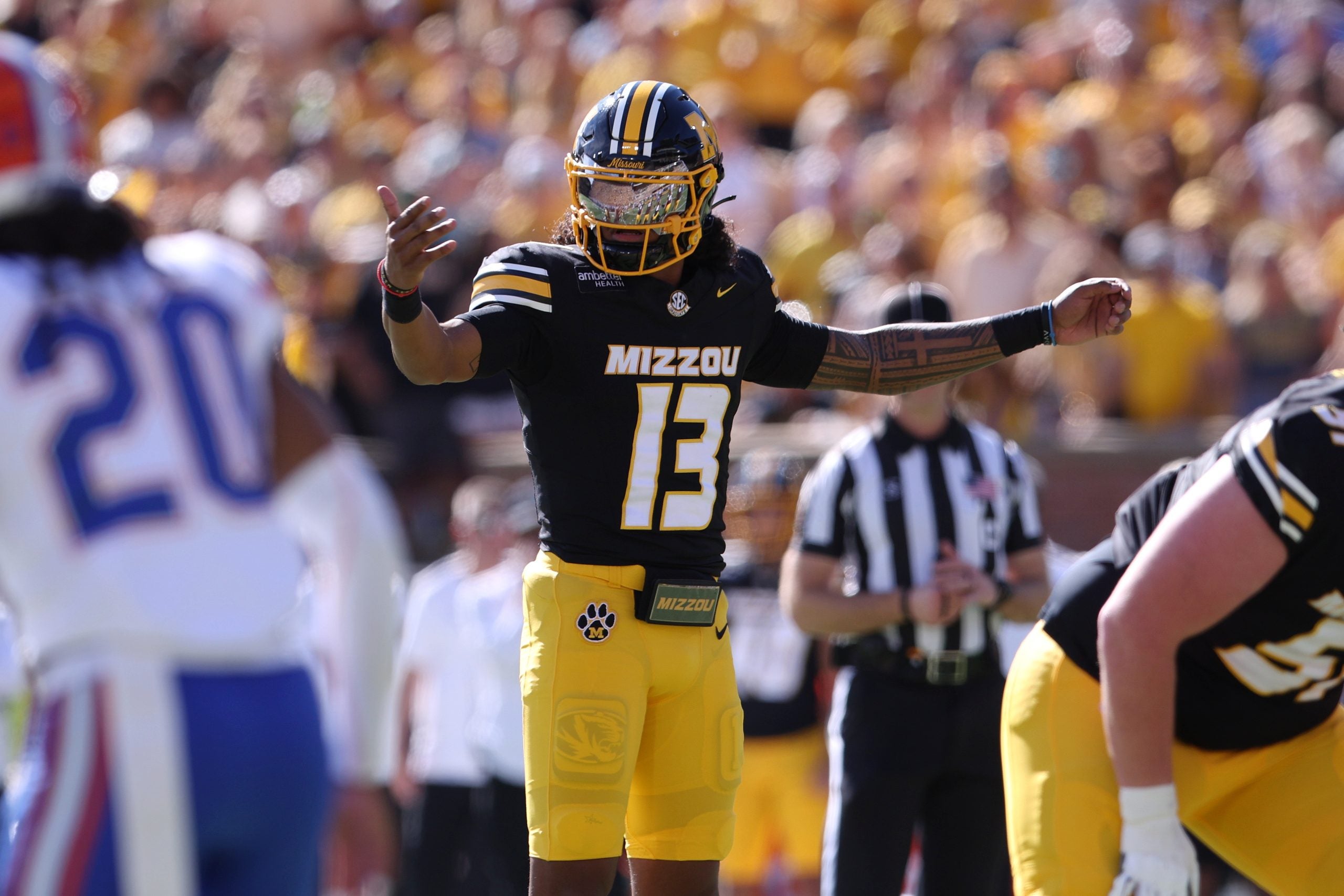 Oct 3, 2026; Columbia, Missouri, USA; Missouri Tigers quarterback Austin Simmons (13) calls a play in the first quarter against the Florida Gators at Faurot Field at Memorial Stadium.