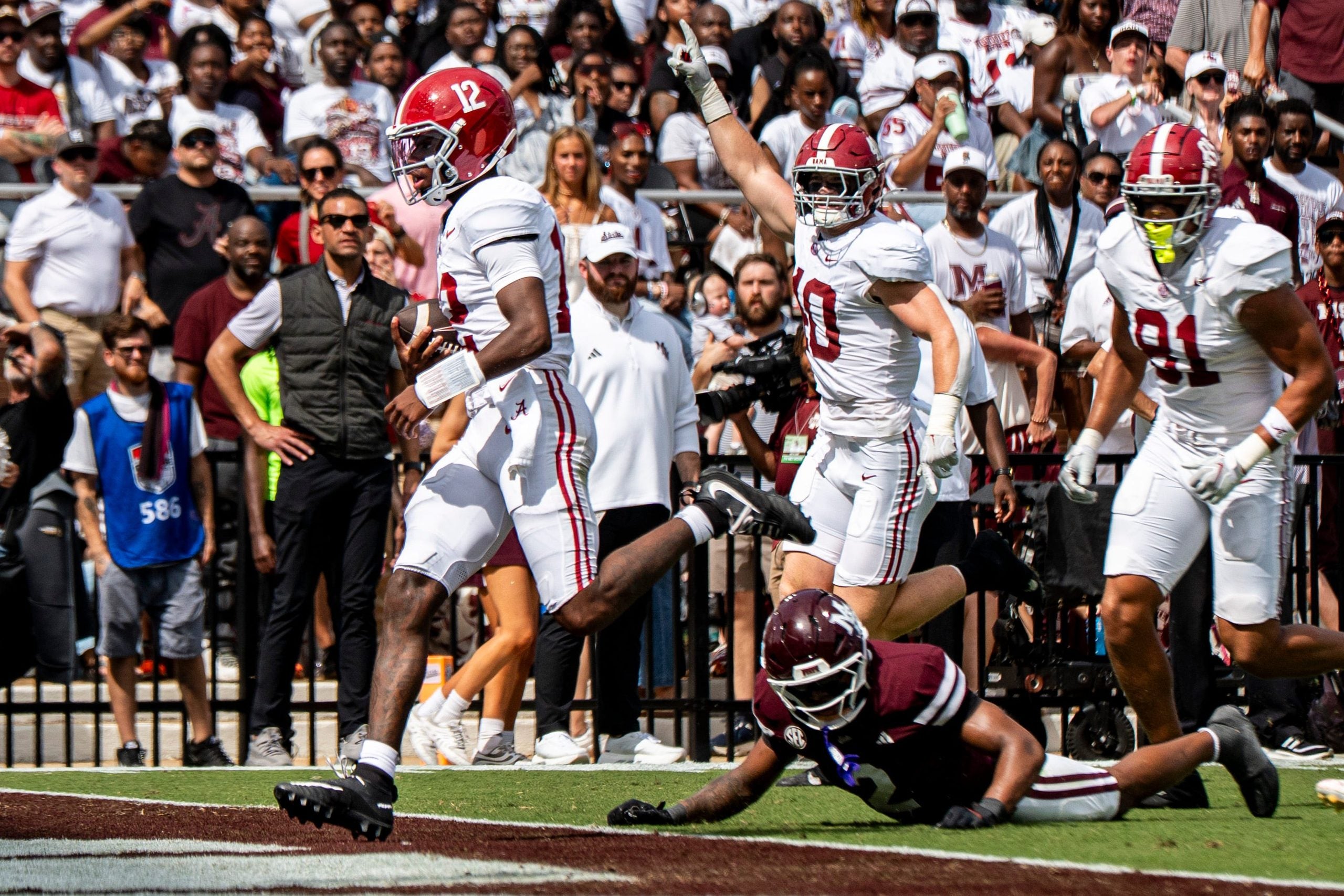 Alabama quarterback Keelon Russell (12) carries the ball for a touchdown during a college football game between Mississippi State and Alabama at Davis Wade Stadium in Starkville, Miss., on Saturday, Oct. 3, 2026. Alabama defeated Mississippi State 56-23.