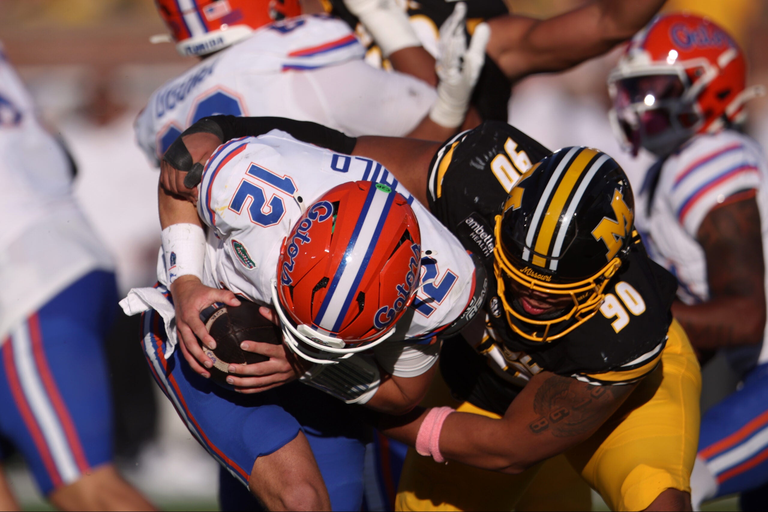Oct 3, 2026; Columbia, Missouri, USA; Missouri Tigers defensive tackle Sterling Webb (90) sacks Florida Gators quarterback Aaron Philo (12) in the fourth quarter at Faurot Field at Memorial Stadium.