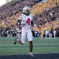 Ohio State Buckeyes wide receiver Jeremiah Smith (4) scores a touchdown, breaking the school's all-time record, during the NCAA football game against the Iowa Hawkeyes at Kinnick Stadium in Iowa City on Oct. 3, 2026. Ohio State on 31-14.