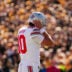 Ohio State Buckeyes quarterback Julian Sayin (10) covers his ears to hear the play call during the NCAA football game against the Iowa Hawkeyes at Kinnick Stadium in Iowa City on Oct. 3, 2026.