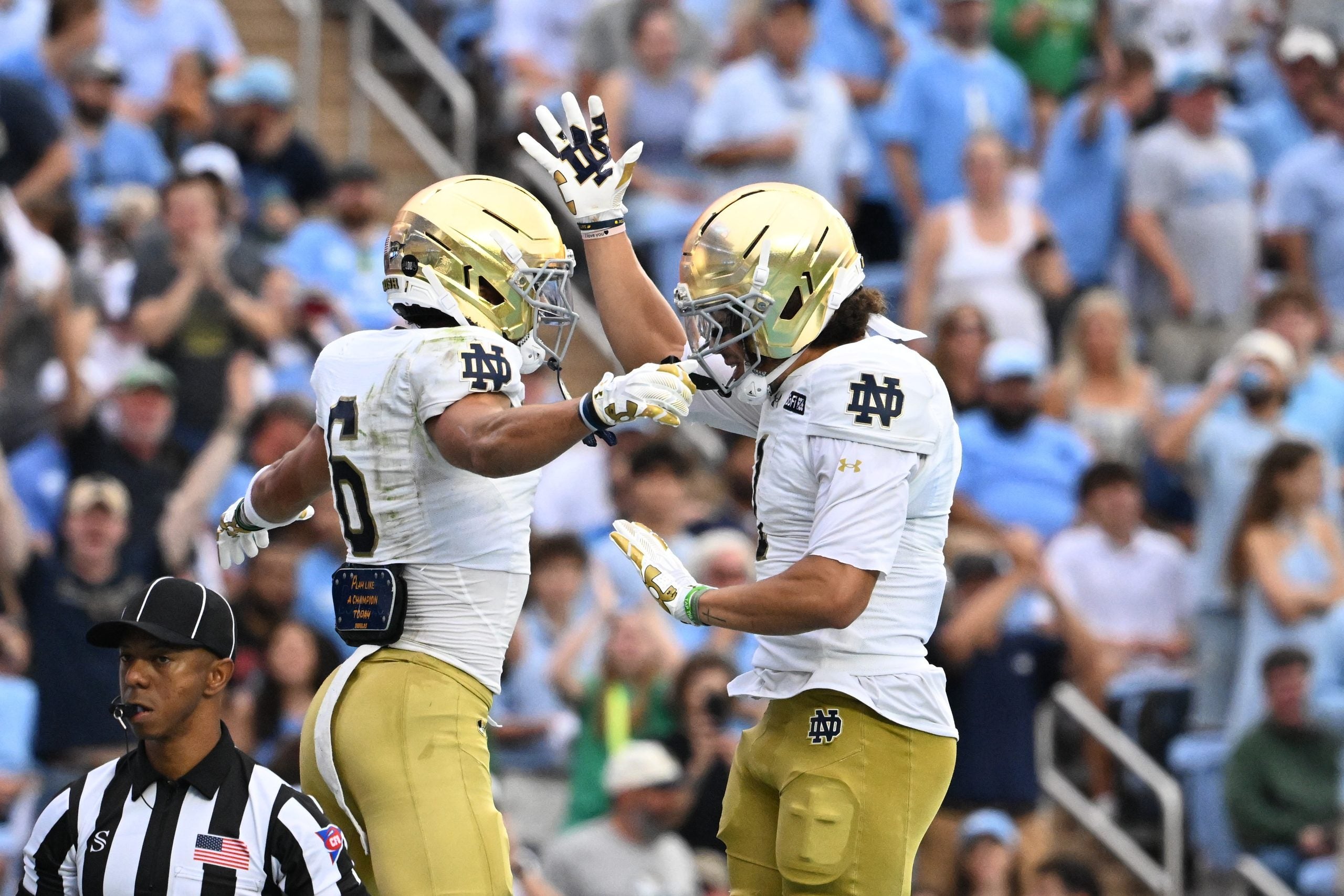 Oct 3, 2026; Chapel Hill, North Carolina, USA; Notre Dame Fighting Irish wide receiver Jordan Faison (6) celebrates with wide receiver Jaden Greathouse (1) after making a touchdown catch in the first quarter at Kenan Stadium.