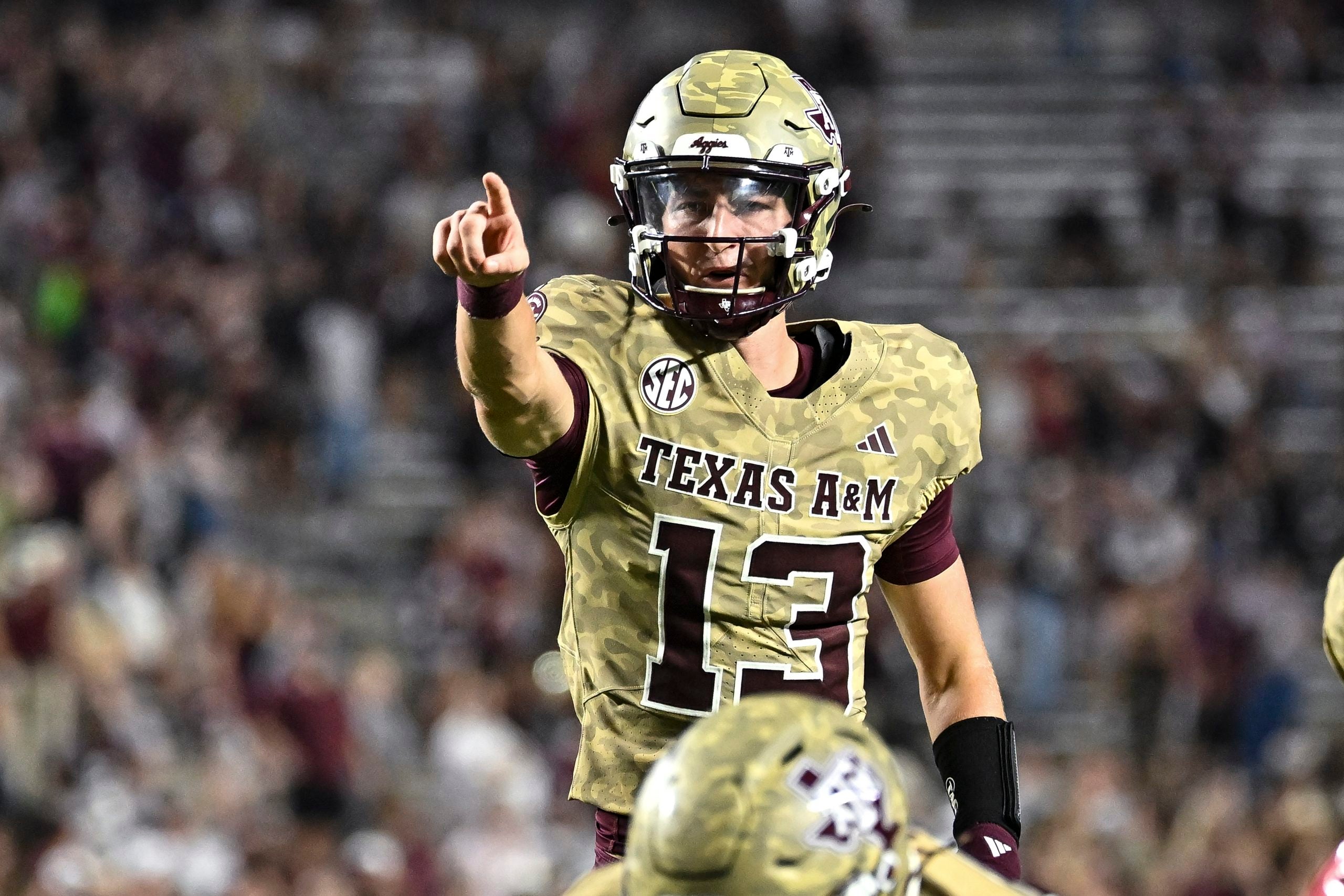 Oct 3, 2026; College Station, Texas, USA; Texas A&M Aggies quarterback Brady Hart (13) motions during the fourth quarter against the Arkansas Razorbacks at Kyle Field.