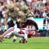 Oct 3, 2026; College Station, Texas, USA; Texas A&M Aggies running back KJ Edwards (0) runs the ball as Arkansas Razorbacks linebacker Ben Bogle (44) attempts a tackle during the first half at Kyle Field.