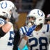 Oct 4, 2026; Tottenham, ENG; Indianapolis Colts running back Jonathan Taylor (28) celebrates his touchdown against the Washington Commanders with guard Quenton Nelson (56) during the third quarter at Tottenham Hotspur Stadium.