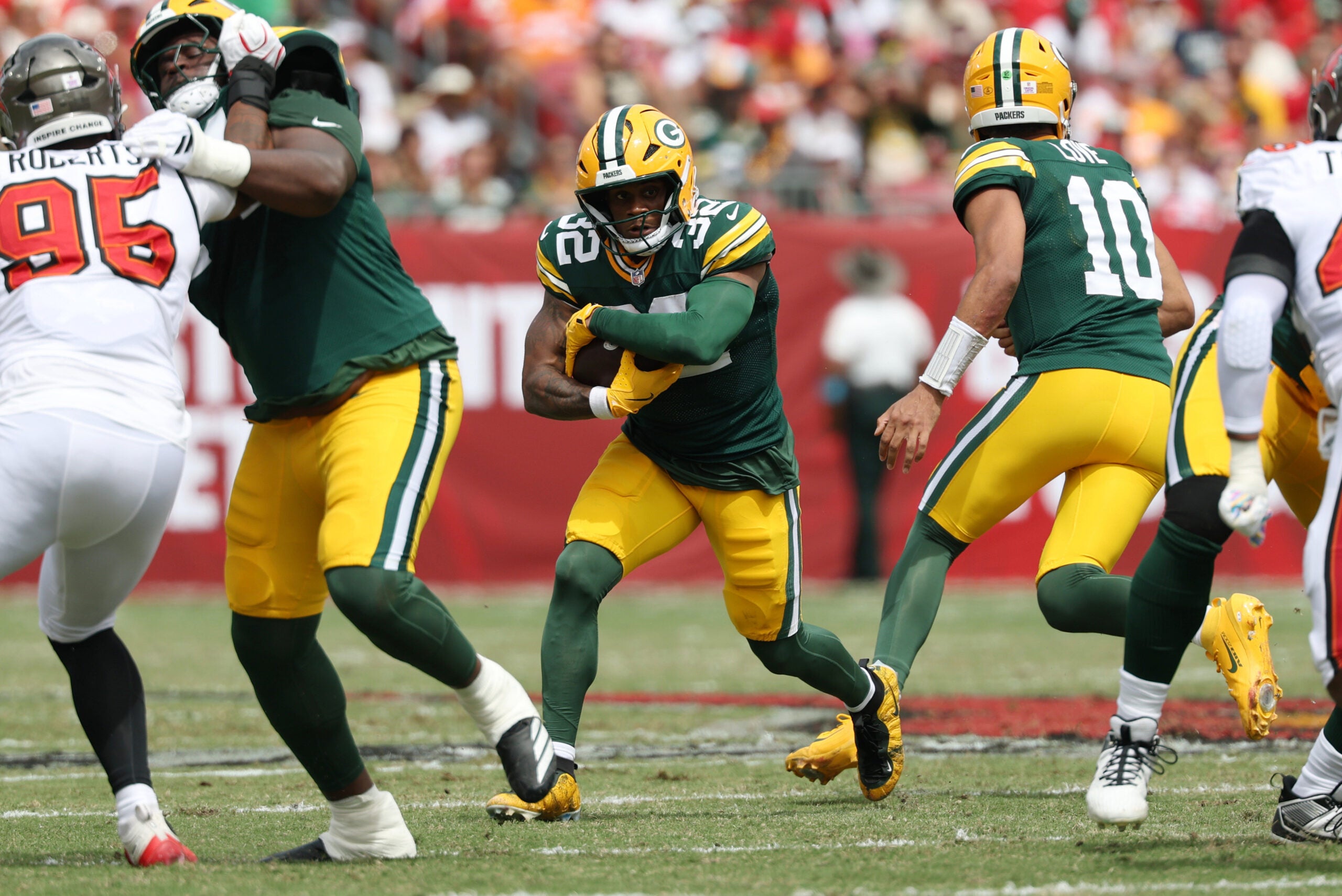 Oct 4, 2026; Tampa, Florida, USA; Green Bay Packers running back MarShawn Lloyd (32) runs with the ball during the first quarter against the Tampa Bay Buccaneers at Raymond James Stadium.