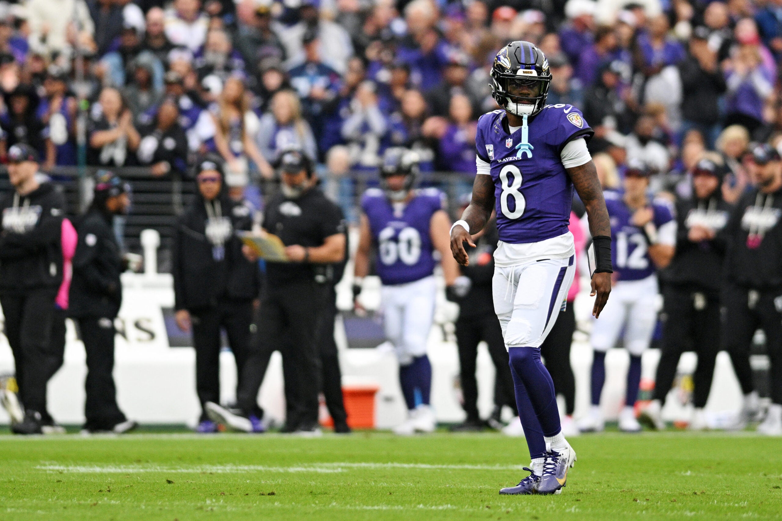 Oct 4, 2026; Baltimore, Maryland, USA; Baltimore Ravens quarterback Lamar Jackson (8) looks on after a play during the first quarter against the Tennessee Titans at M&T Bank Stadium.