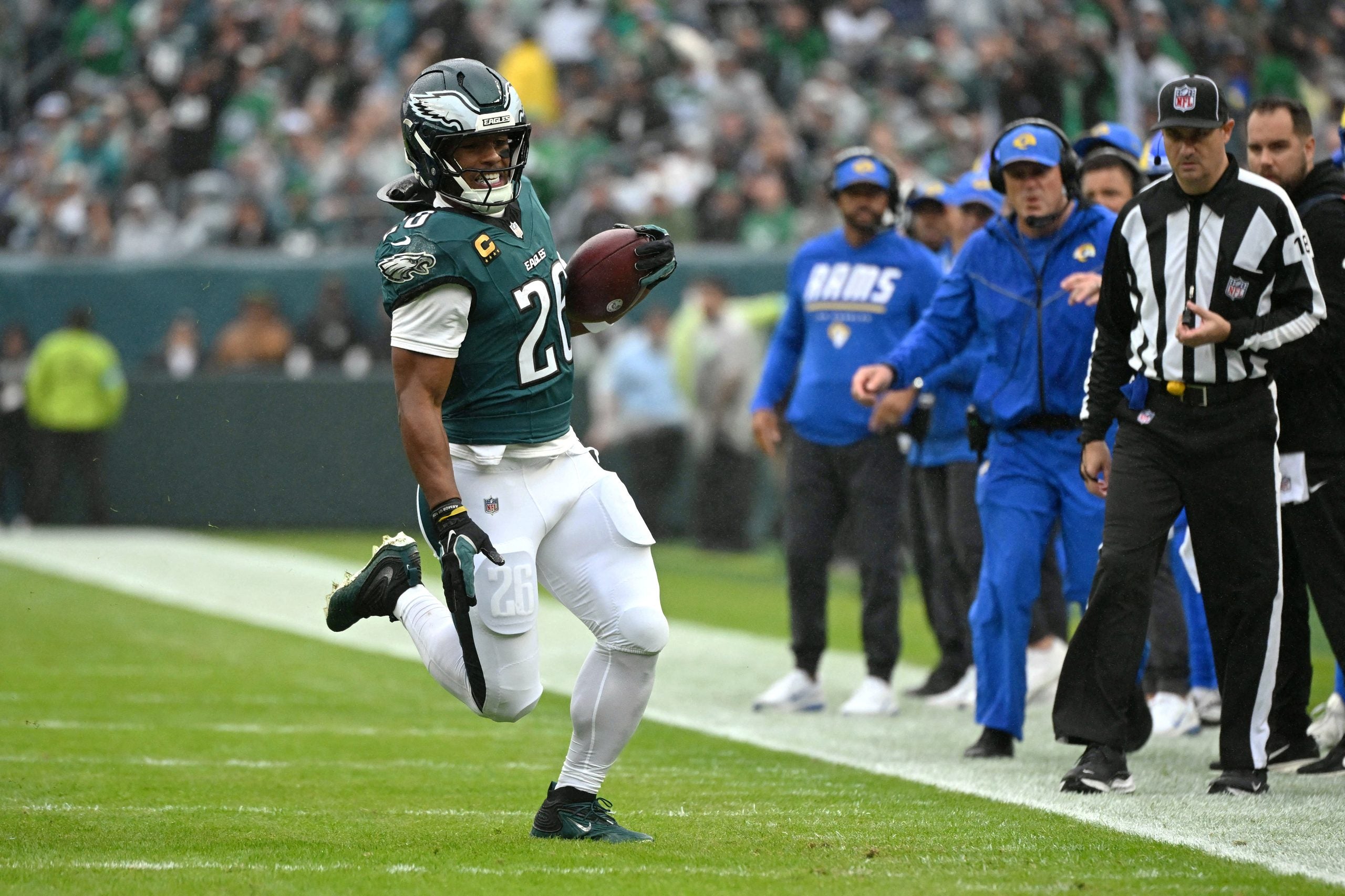 Oct 4, 2026; Philadelphia, Pennsylvania, USA; Philadelphia Eagles running back Saquon Barkley (26) runs the ball against the Los Angeles Rams during the first quarter at Lincoln Financial Field.