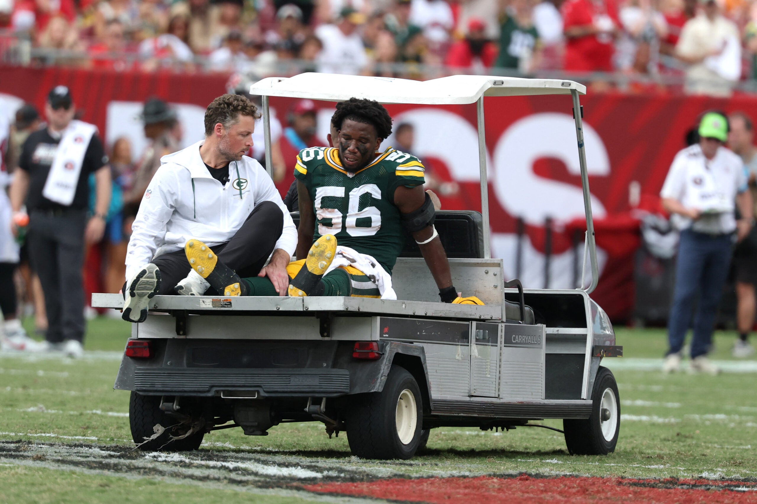 Oct 4, 2026; Tampa, Florida, USA; Green Bay Packers linebacker Edgerrin Cooper (56) is carted off the field during the game against the Tampa Bay Buccaneers at Raymond James Stadium.