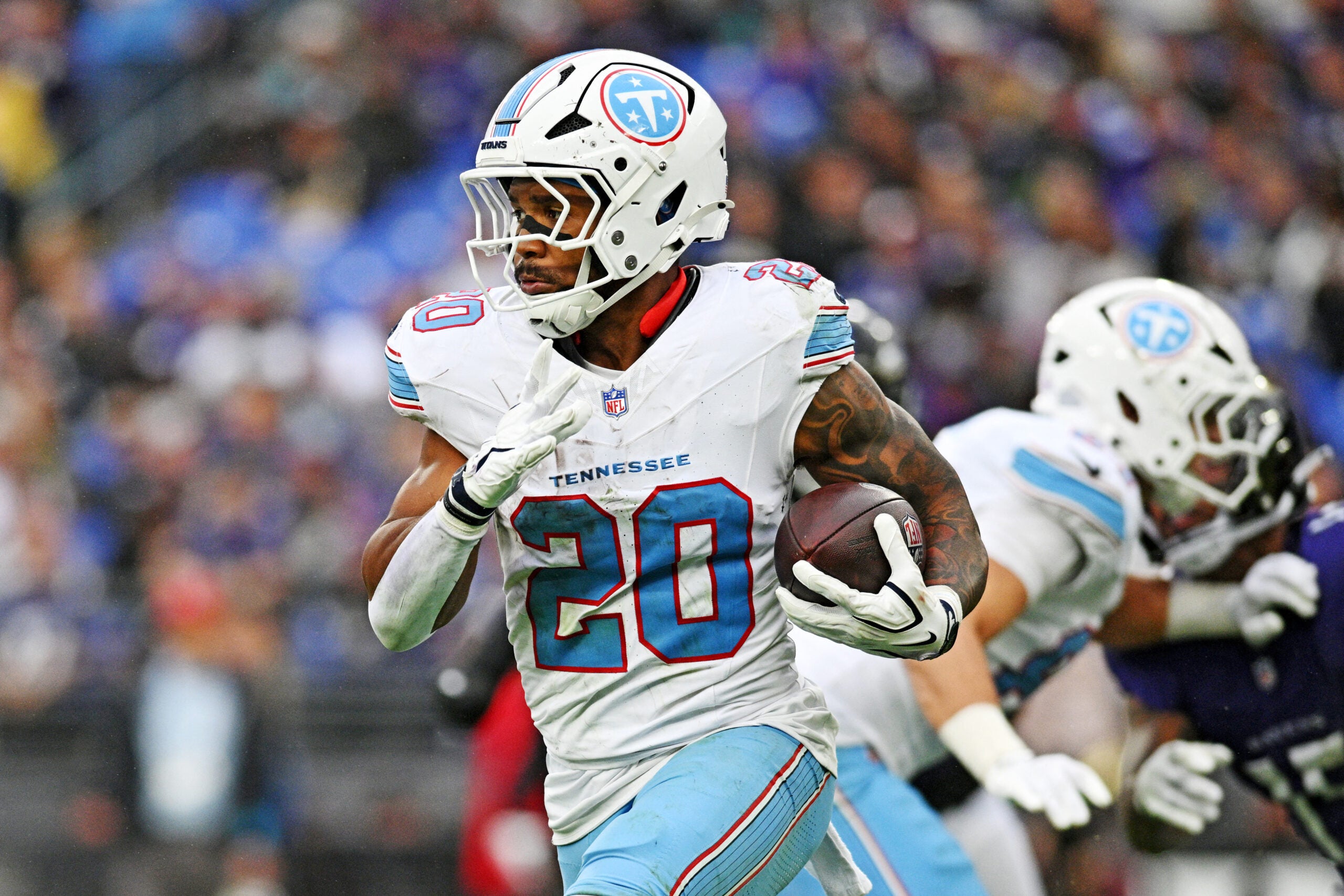 Oct 4, 2026; Baltimore, Maryland, USA; Tennessee Titans running back Tony Pollard (20) runs the ball during the third quarter against the Baltimore Ravens at M&T Bank Stadium.