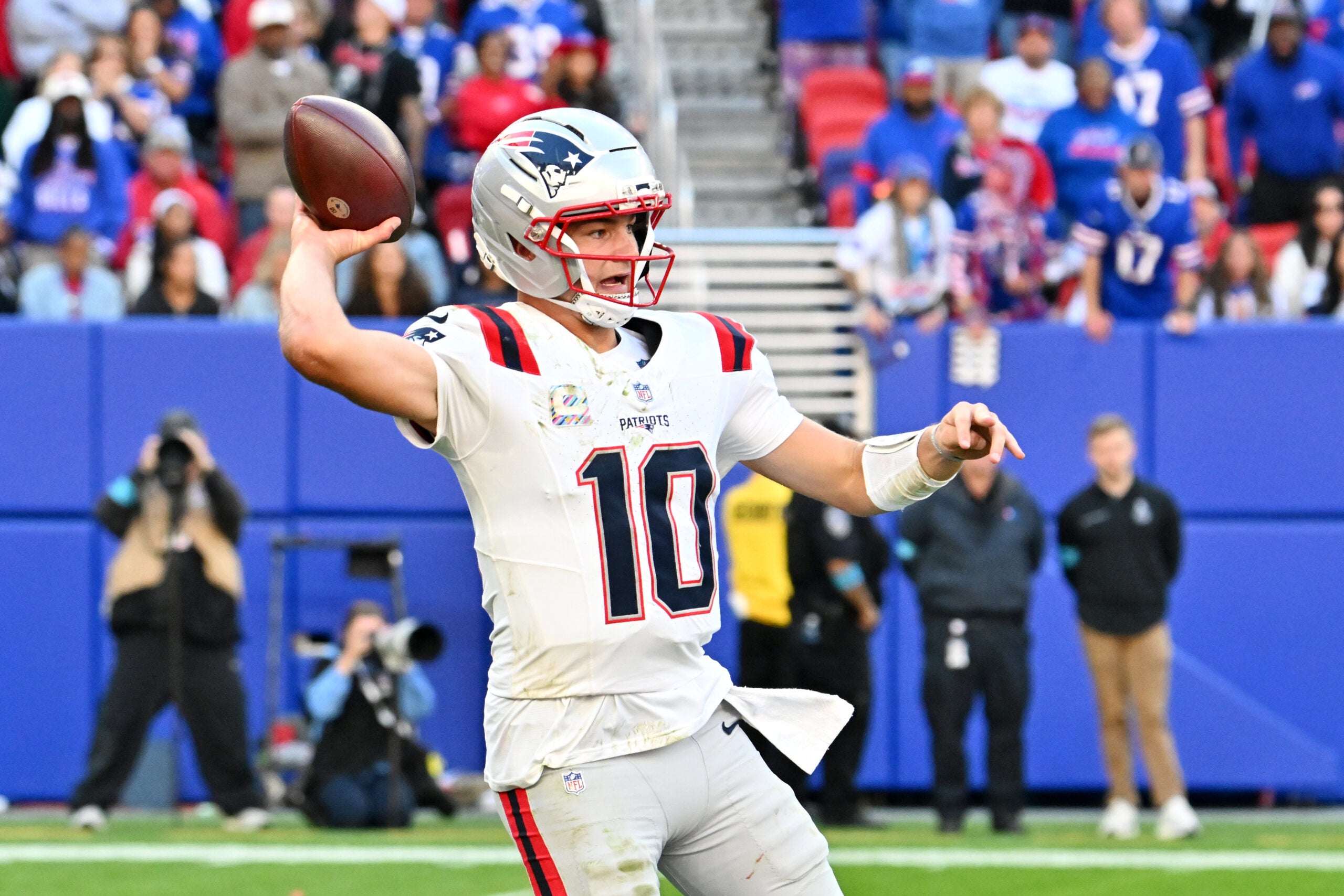 Oct 4, 2026; Orchard Park, New York, USA; New England Patriots quarterback Drake Maye (10) throws a pass during the fourth quarter against the Buffalo Bills at New Highmark Stadium.
