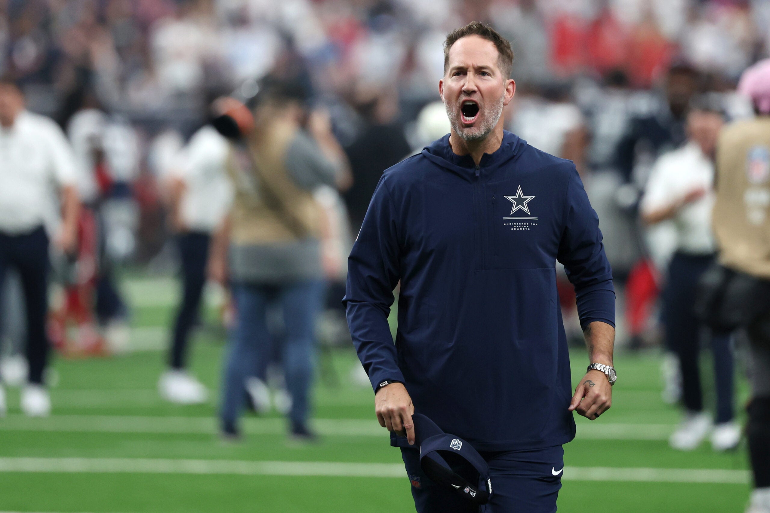 Oct 4, 2026; Houston, Texas, USA; Dallas Cowboys head coach Brian Schottenheimer celebrates as he leaves the field following a game against the Houston Texans at Reliant Stadium.