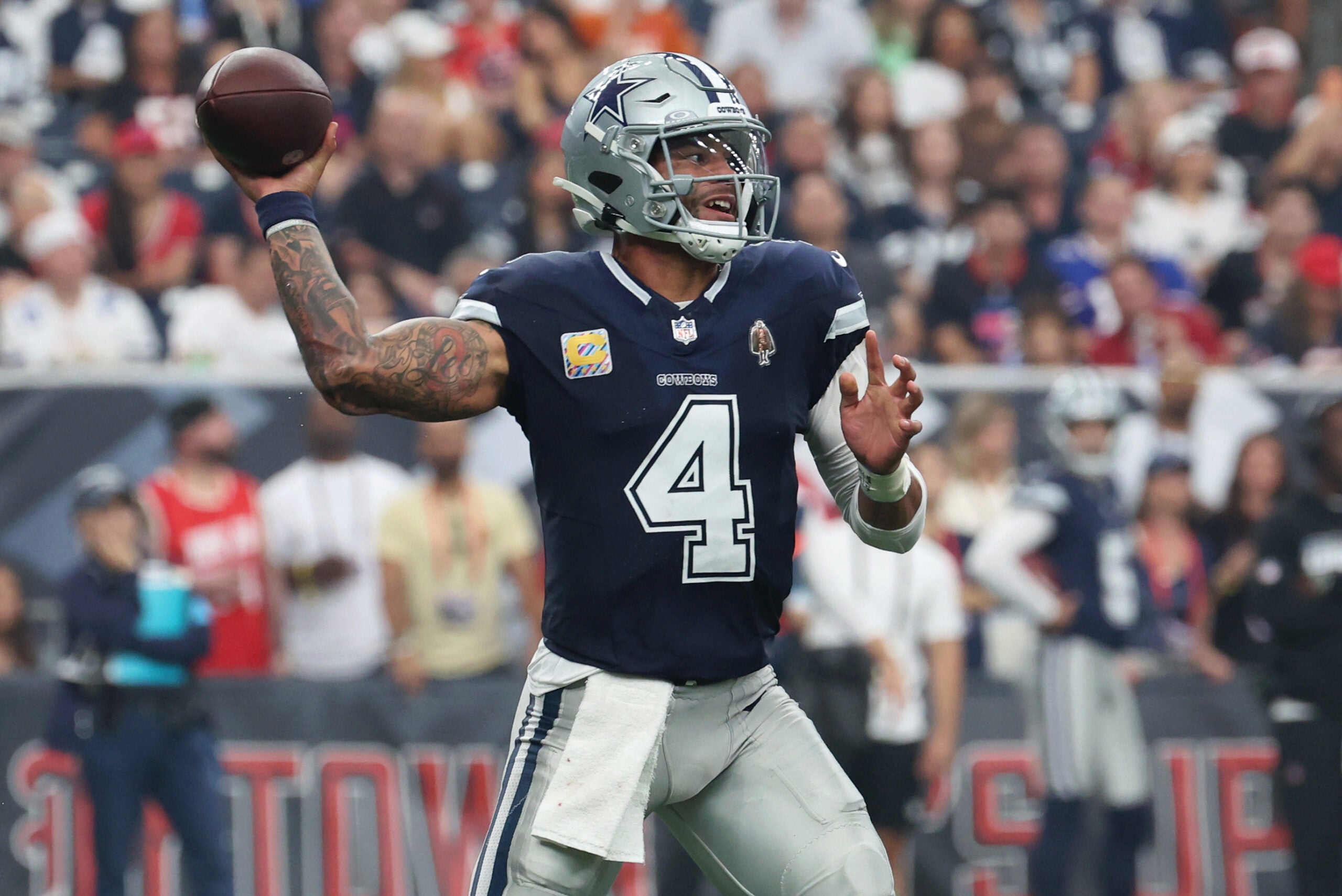 Oct 4, 2026; Houston, Texas, USA; Dallas Cowboys quarterback Dak Prescott (4) passes the ball against the Houston Texans during the first half at Reliant Stadium.