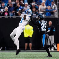 Detroit Lions wide receiver Jameson Williams (1) makes a catch against Carolina Panthers cornerback Akayleb Evans (29) during the first half at Bank of America Stadium in Charlotte on Sunday, Oct. 4, 2026.