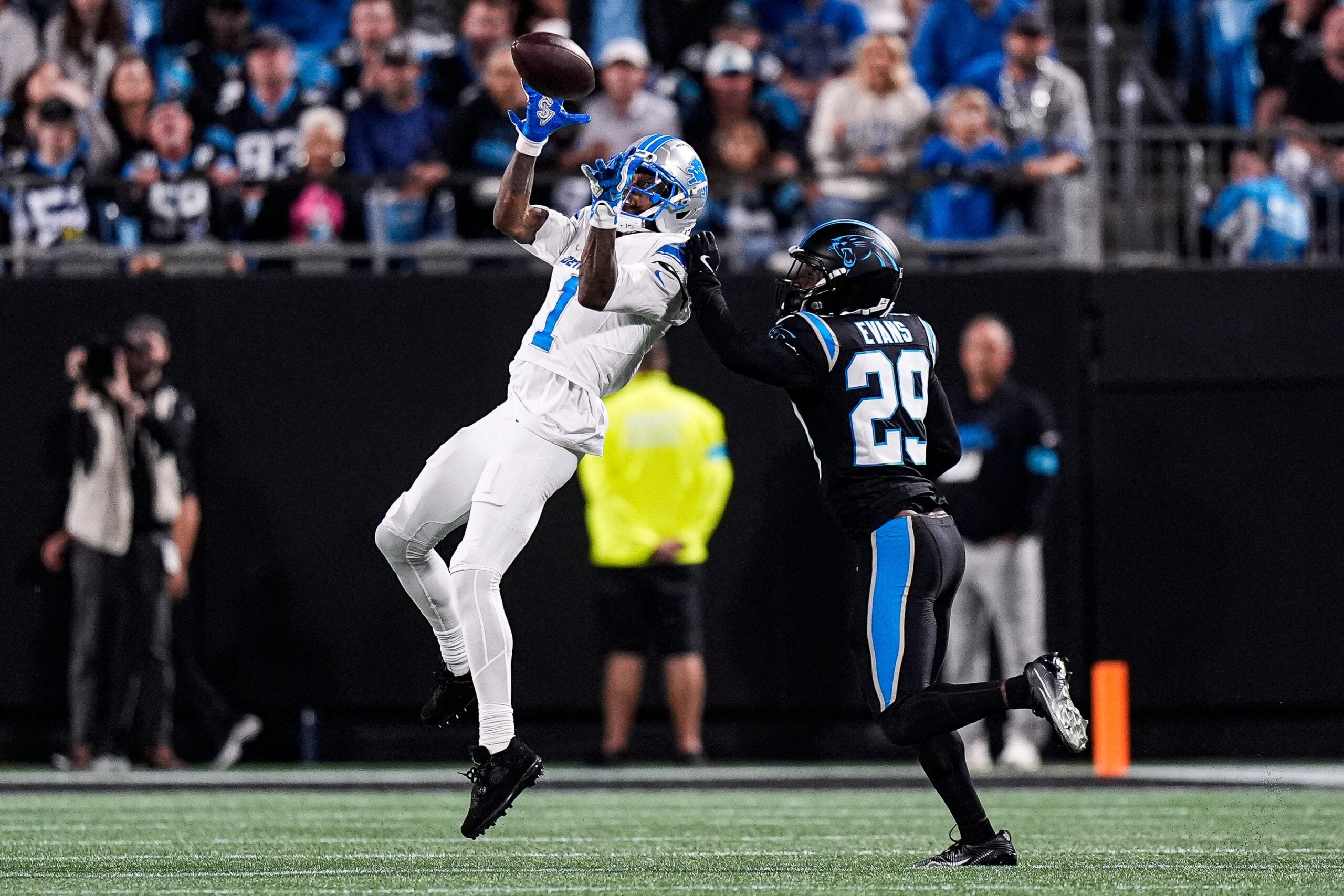 Detroit Lions wide receiver Jameson Williams (1) makes a catch against Carolina Panthers cornerback Akayleb Evans (29) during the first half at Bank of America Stadium in Charlotte on Sunday, Oct. 4, 2026.