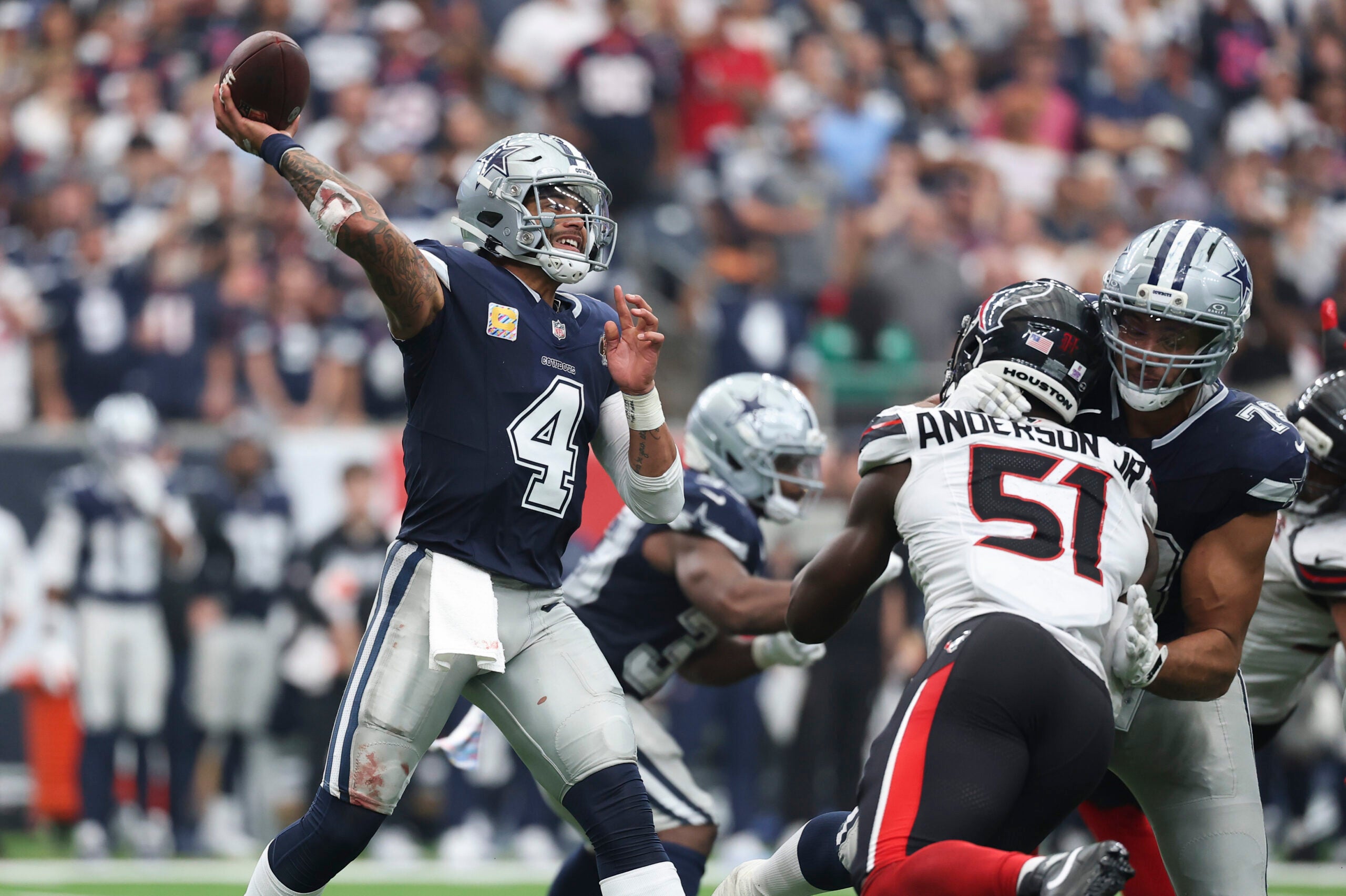 Oct 4, 2026; Houston, Texas, USA; Dallas Cowboys quarterback Dak Prescott (4) attempts a pass during the game against the Houston Texans at Reliant Stadium.