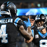 Oct 4, 2026; Charlotte, North Carolina, USA; Carolina Panthers wide receiver Tetairoa McMillan (4) celebrates with quarterback Bryce Young (9) after scoring a touchdown against the Detroit Lions during the third quarter at Bank of America Stadium.