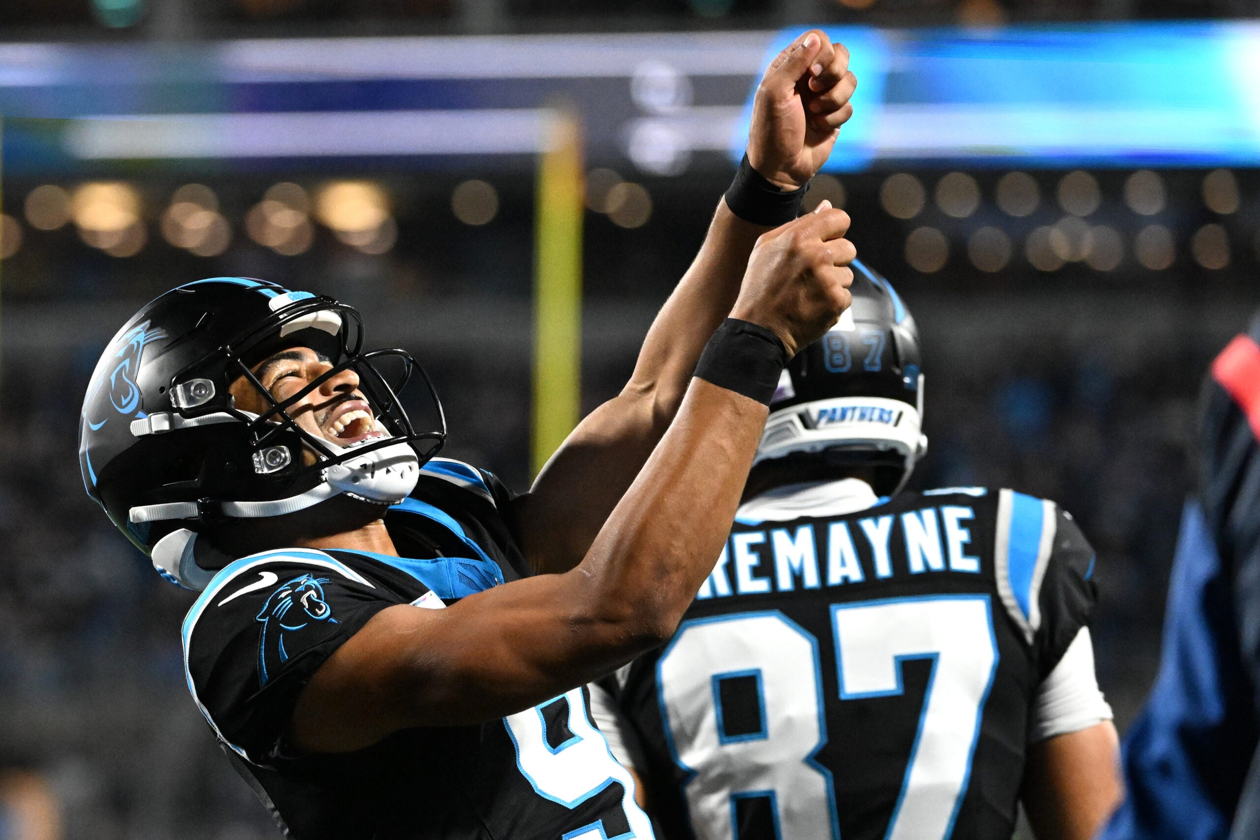 Oct 4, 2026; Charlotte, North Carolina, USA; Carolina Panthers quarterback Bryce Young (9) celebrates after a touchdown by wide receiver Tetairoa McMillan (not pictured) against the Detroit Lions during the third quarter at Bank of America Stadium.