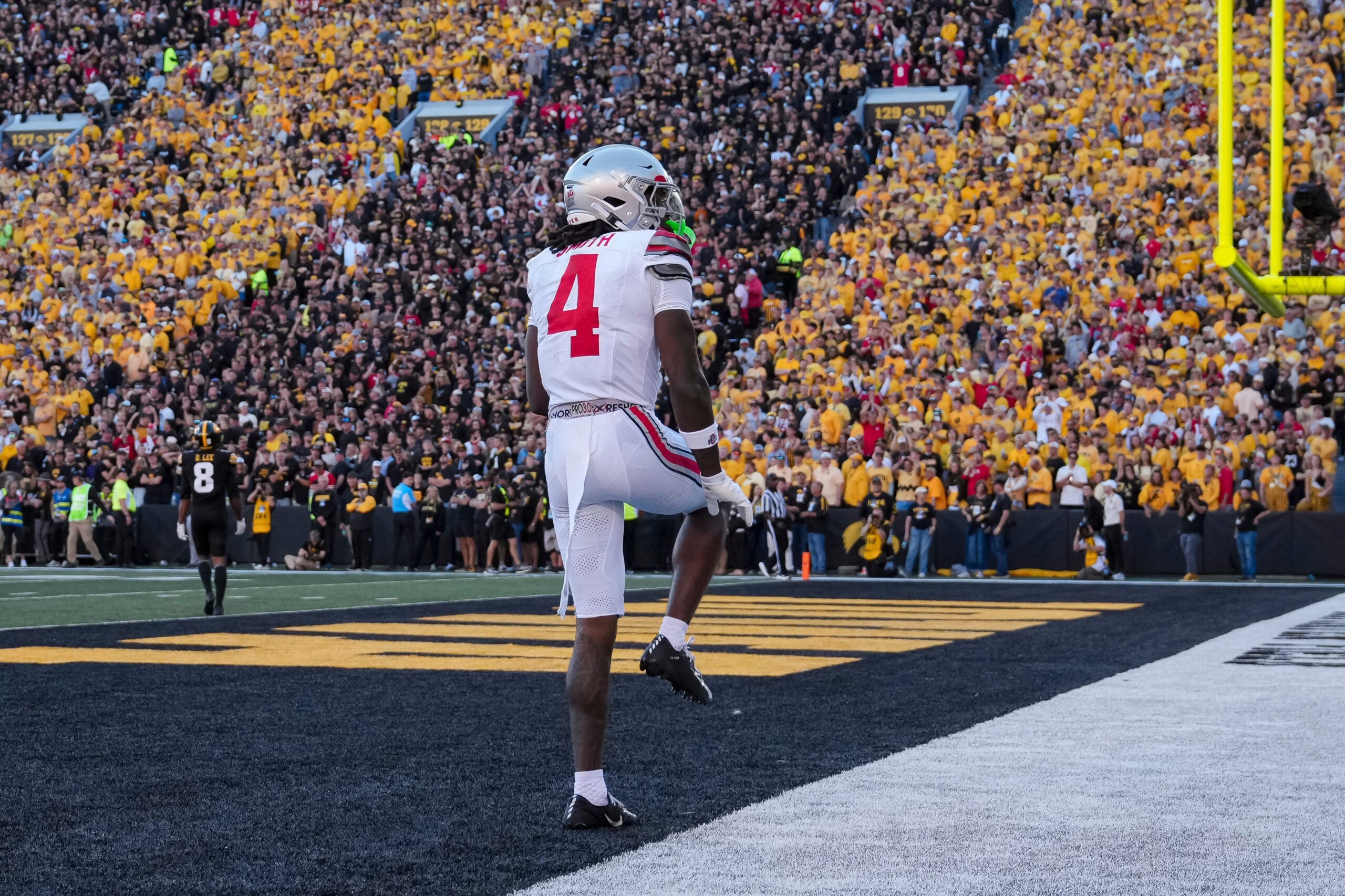 Ohio State Buckeyes wide receiver Jeremiah Smith (4) strikes a Heisman pose after catching a touchdown pass, breaking the school record, during the NCAA football game against the Iowa Hawkeyes at Kinnick Stadium in Iowa City on Oct. 3, 2026.