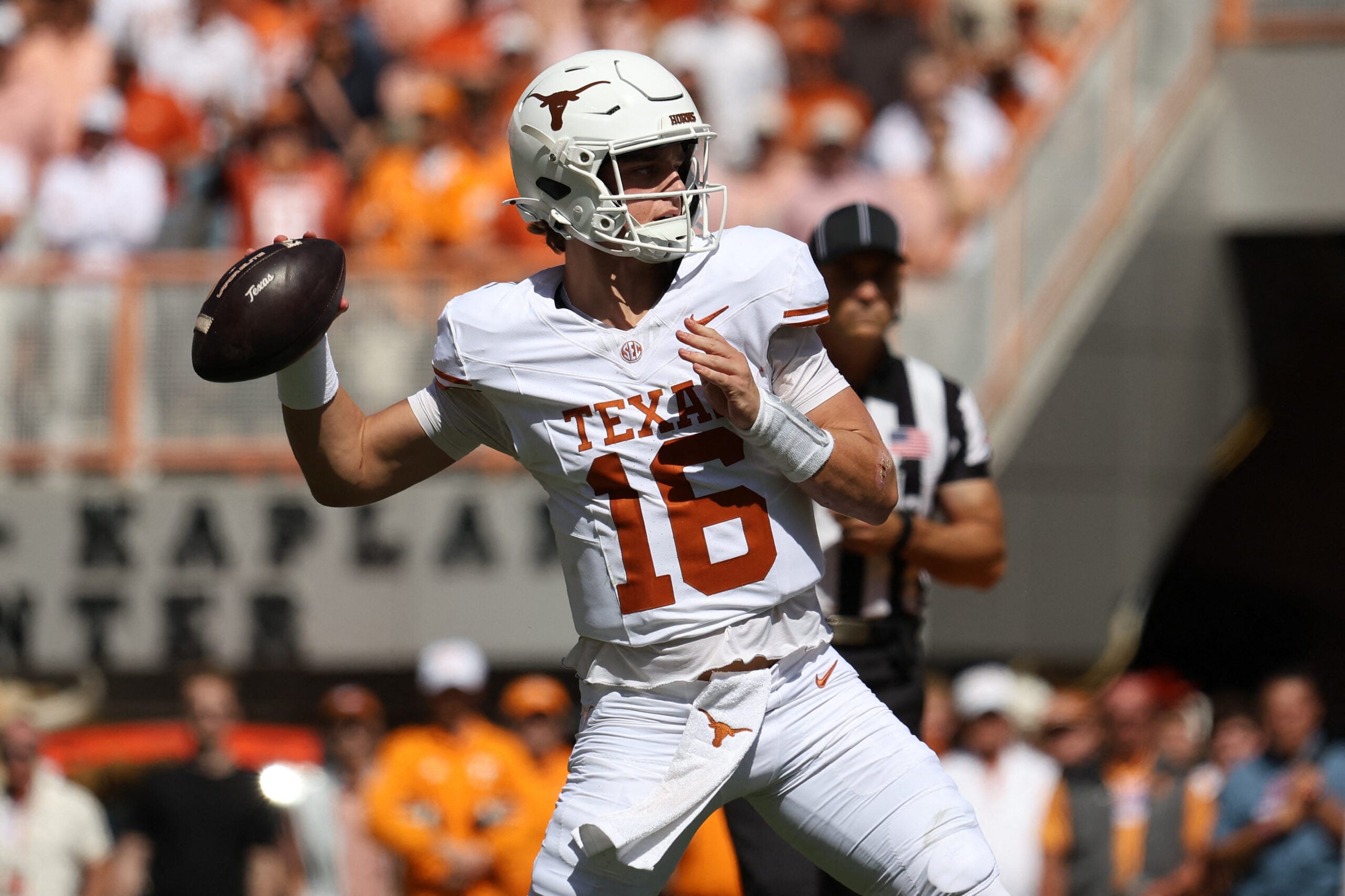 Sep 26, 2026; Knoxville, Tennessee, USA; Texas Longhorns quarterback Arch Manning (16) passes Tennessee Volunteers during the first half at Neyland Stadium.