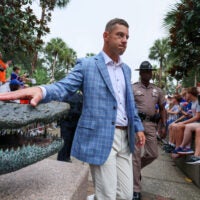 Florida head coach Jon Sumrall touches the gator for luck during Gator Walk before an NCAA football at Steve Spurrier Field at Ben Hill Griffin Stadium in Gainesville, FL on Saturday, October 10, 2026.