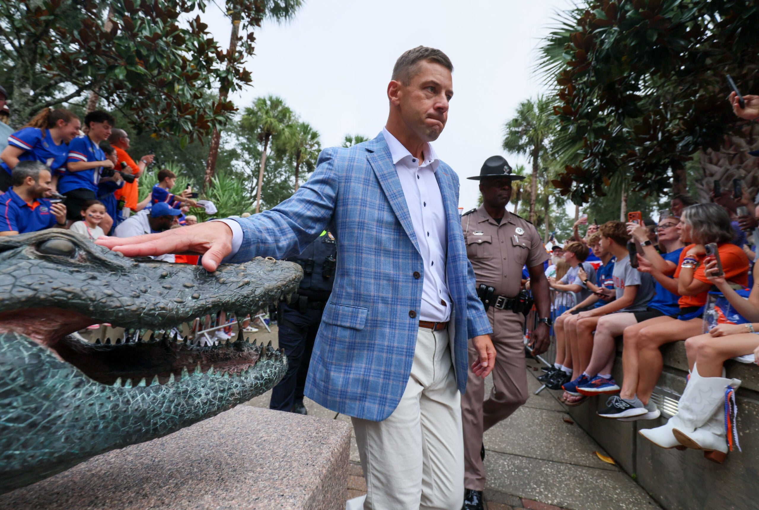 Florida head coach Jon Sumrall touches the gator for luck during Gator Walk before an NCAA football at Steve Spurrier Field at Ben Hill Griffin Stadium in Gainesville, FL on Saturday, October 10, 2026.