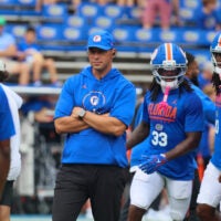 Florida head coach Jon Sumrall watches warm up before taking on South Carolina before an NCAA football at Steve Spurrier Field at Ben Hill Griffin Stadium in Gainesville, FL on Saturday, October 10, 2026.