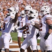 Oct 10, 2026; Dallas, Texas, USA; Texas Longhorns wide receiver Cam Coleman (8) celebrates after catching a pass to score a touchdown against the Oklahoma Sooners during the first half at Cotton Bowl.