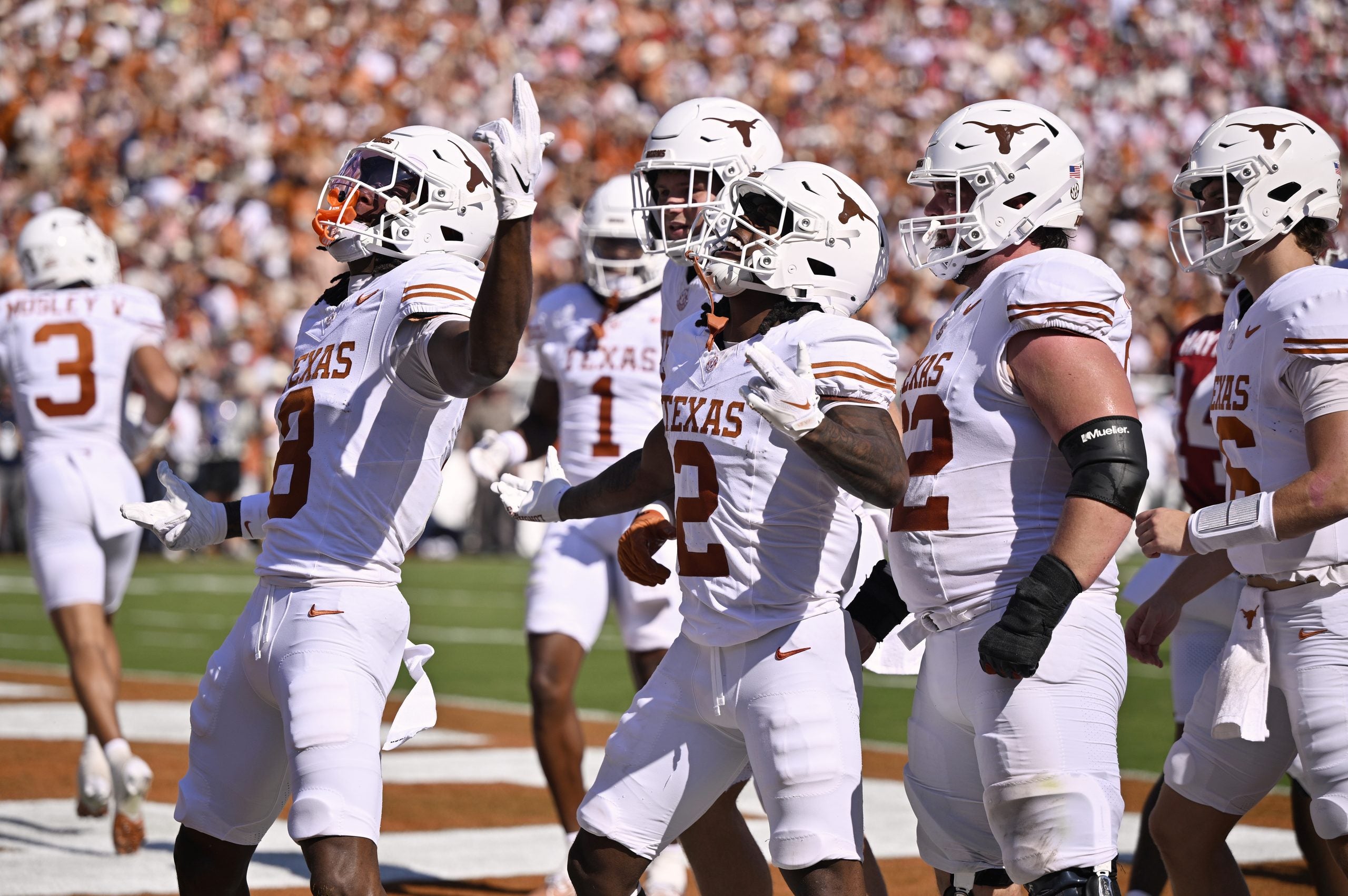 Oct 10, 2026; Dallas, Texas, USA; Texas Longhorns wide receiver Cam Coleman (8) celebrates after catching a pass to score a touchdown against the Oklahoma Sooners during the first half at Cotton Bowl.