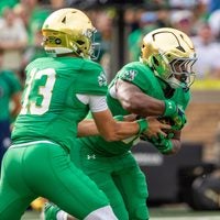 Oct 10, 2026; South Bend, Indiana, USA; Notre Dame Fighting Irish quarterback CJ Carr (13) hands off to running back Jonaz Walton (20) against the Stanford Cardinal during the first half at Notre Dame Stadium.