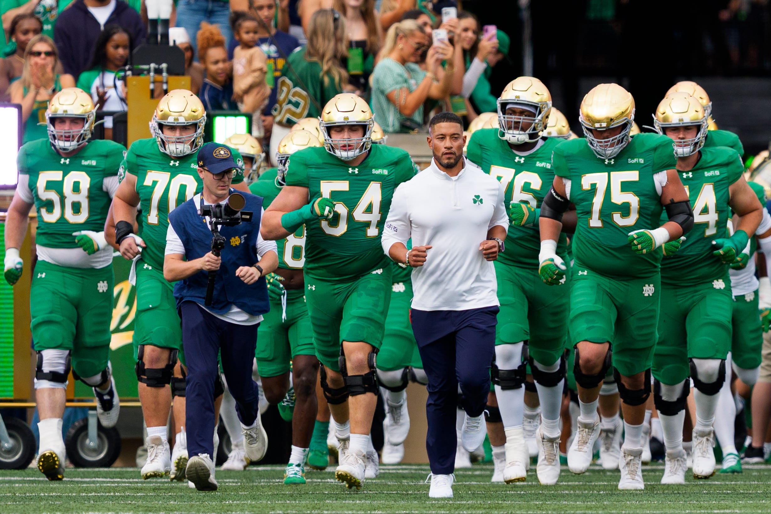 Notre Dame head coach Marcus Freeman leads the team onto the field before a NCAA football game against Stanford at Notre Dame Stadium on Saturday, Oct. 10, 2026, in South Bend.