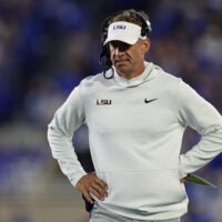 Oct 10, 2026; Lexington, Kentucky, USA; LSU Tigers head coach Lane Kiffin walks on the sideline during the first quarter against the Kentucky Wildcats at Kroger Field.