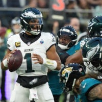 Oct 11, 2026; Tottenham, ENG; Philadelphia Eagles quarterback Jalen Hurts (1) looks to pass during the second half against the Jacksonville Jaguars at Tottenham Hotspur Stadium.