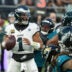 Oct 11, 2026; Tottenham, ENG; Philadelphia Eagles quarterback Jalen Hurts (1) looks to pass during the second half against the Jacksonville Jaguars at Tottenham Hotspur Stadium.