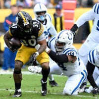 Oct 11, 2026; Pittsburgh, Pennsylvania, USA; Pittsburgh Steelers running back Jaylen Warren (30) is tackled by Indianapolis Colts defensive tackle Jerry Tillery (94) in the second quarter at Acrisure Stadium.