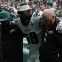 Oct 11, 2026; Tottenham, ENG; Philadelphia Eagles linebacker Jalyx Hunt (58) is hleped off the field after an injury during the game against the Jacksonville Jaguars at Tottenham Hotspur Stadium.