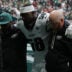 Oct 11, 2026; Tottenham, ENG; Philadelphia Eagles linebacker Jalyx Hunt (58) is hleped off the field after an injury during the game against the Jacksonville Jaguars at Tottenham Hotspur Stadium.