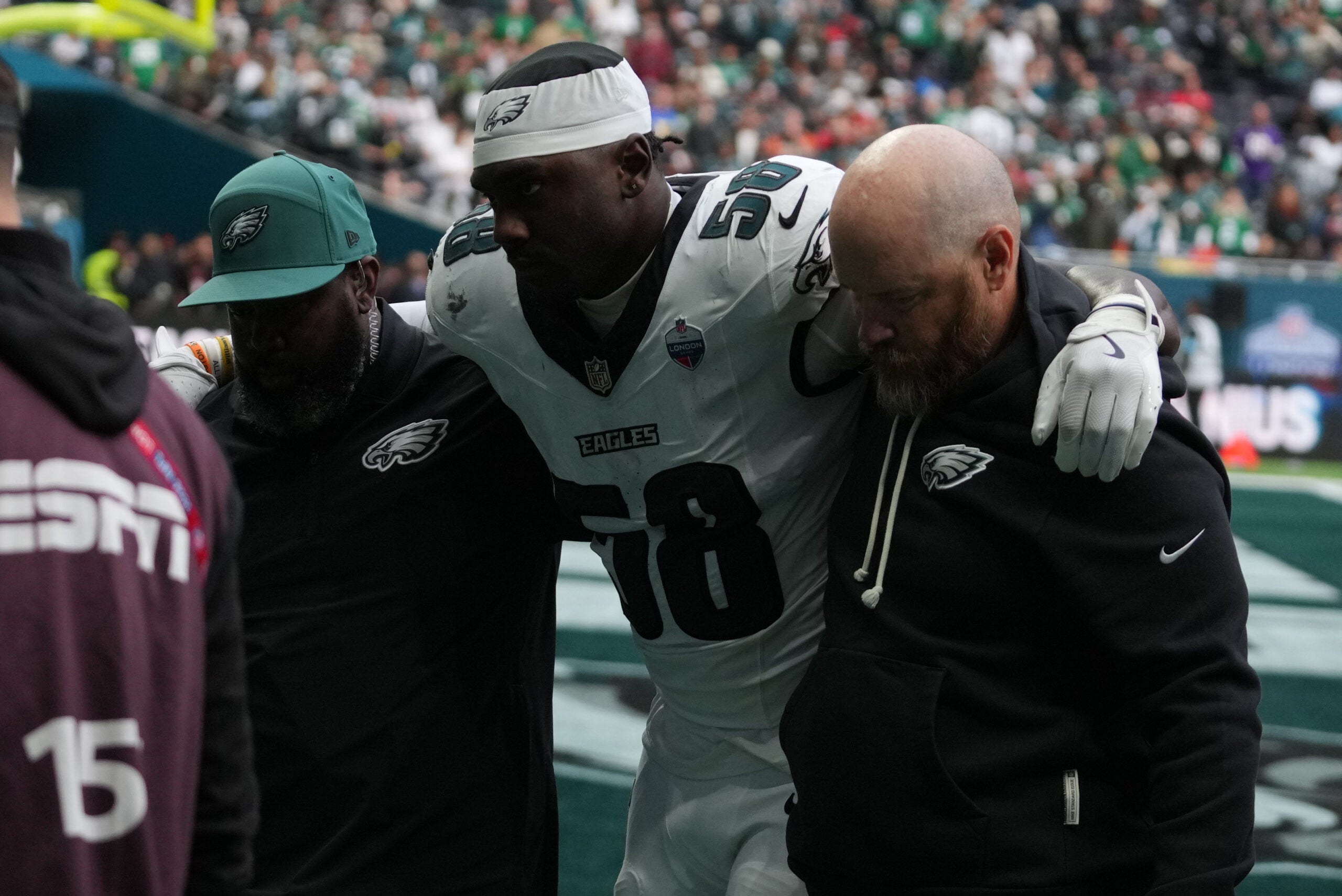 Oct 11, 2026; Tottenham, ENG; Philadelphia Eagles linebacker Jalyx Hunt (58) is hleped off the field after an injury during the game against the Jacksonville Jaguars at Tottenham Hotspur Stadium.