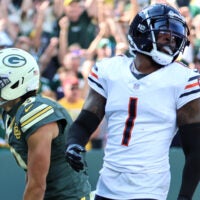 Oct 11, 2026; Green Bay, Wisconsin, USA; Green Bay Packers wide receiver Christian Watson (9) celebrates after scoring a touchdown as Chicago Bears defensive back Jaylon Johnson (1) reacts during the third quarter at Lambeau Field.