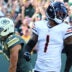 Oct 11, 2026; Green Bay, Wisconsin, USA; Green Bay Packers wide receiver Christian Watson (9) celebrates after scoring a touchdown as Chicago Bears defensive back Jaylon Johnson (1) reacts during the third quarter at Lambeau Field.