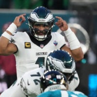 Oct 11, 2026; Tottenham, ENG; Philadelphia Eagles quarterback Jalen Hurts (1) signals during the second half against the Jacksonville Jaguars at Tottenham Hotspur Stadium.
